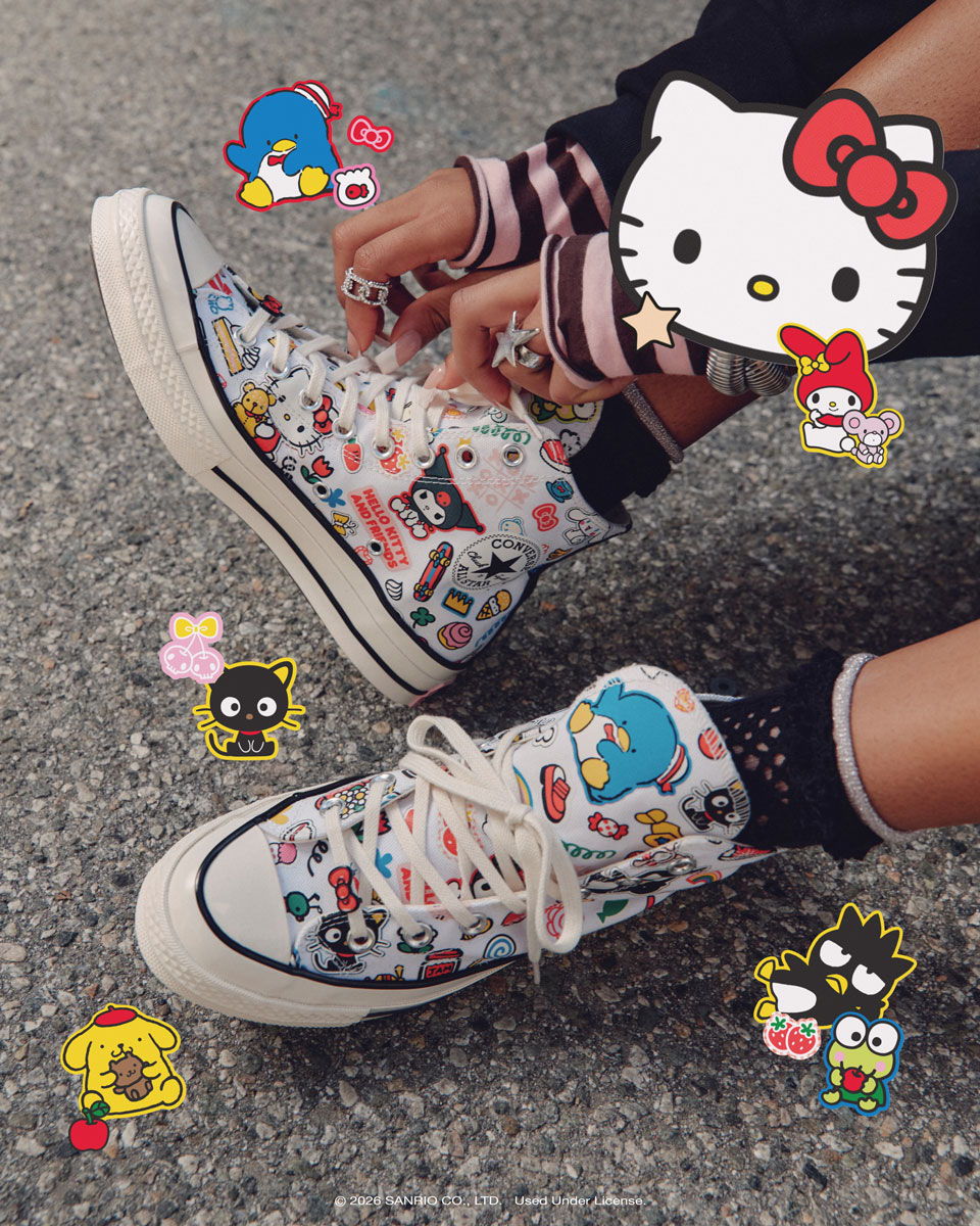 Colorful sneakers decorated with cartoon characters on a textured surface.