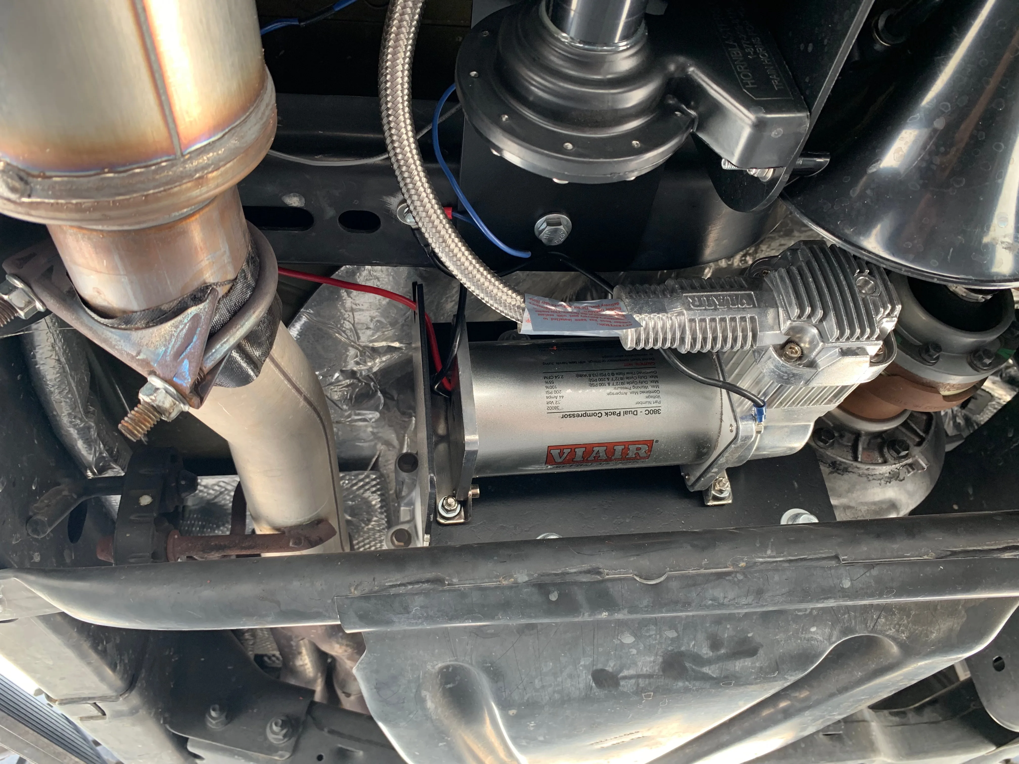 Matte black HornBlasters air tank mounted under Annie's Wrangler JKU logo slogan brass fittings pressure gauge near 110 PSI pressure switch red blue wires Wrango Horn Kit photo 5
