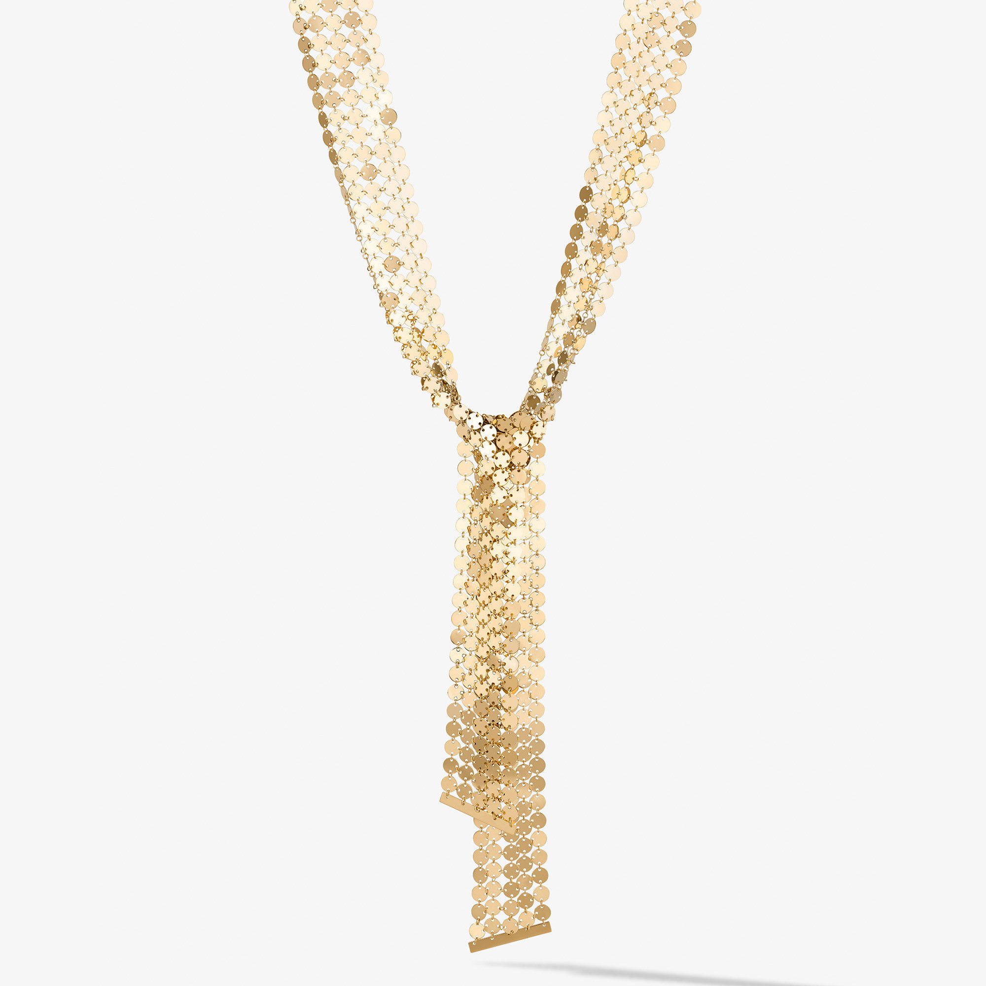 Gold chain necklace with a decorative tassel design.