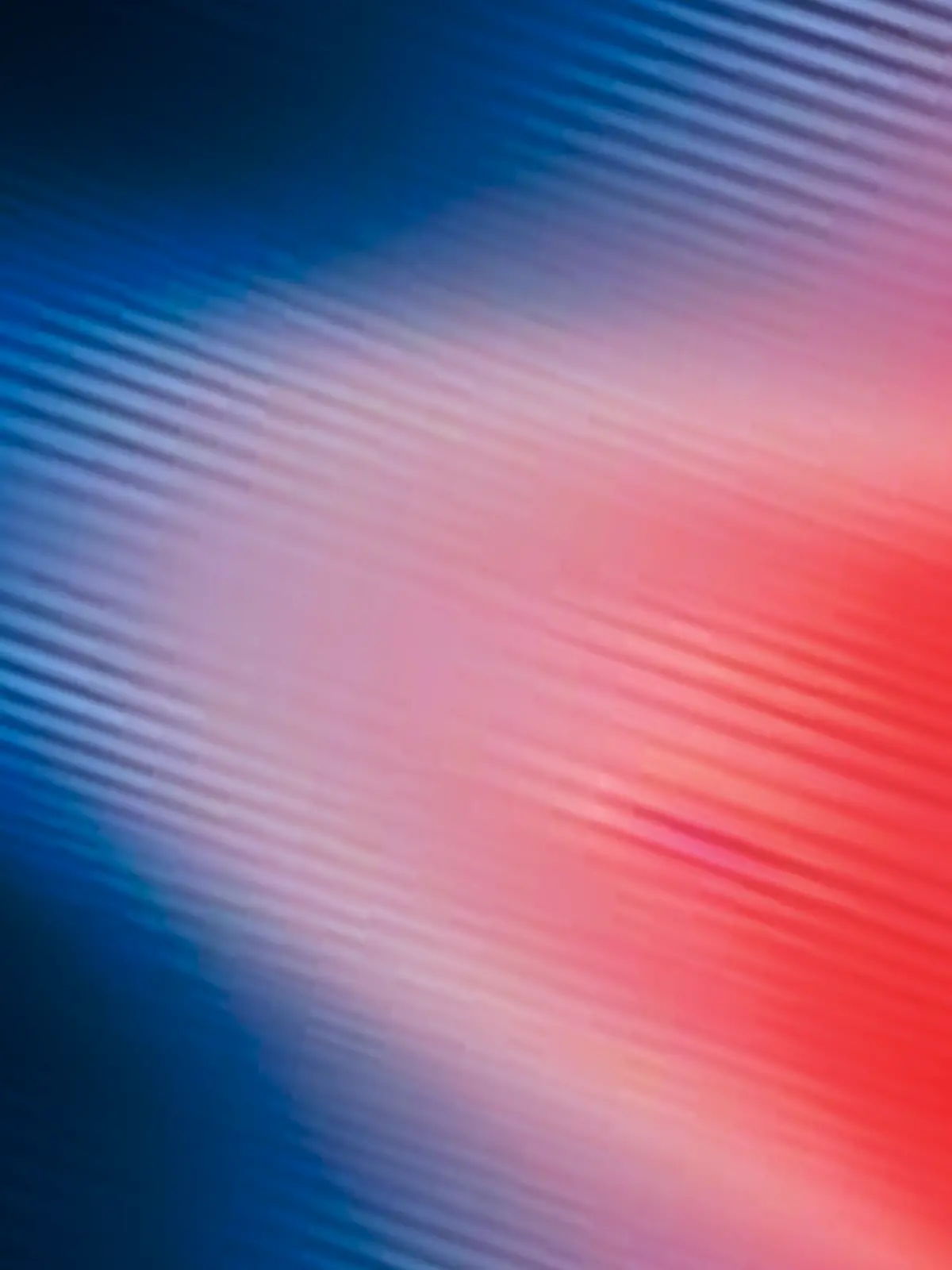Abstract blue and red gradient with soft lines and blurred effect.