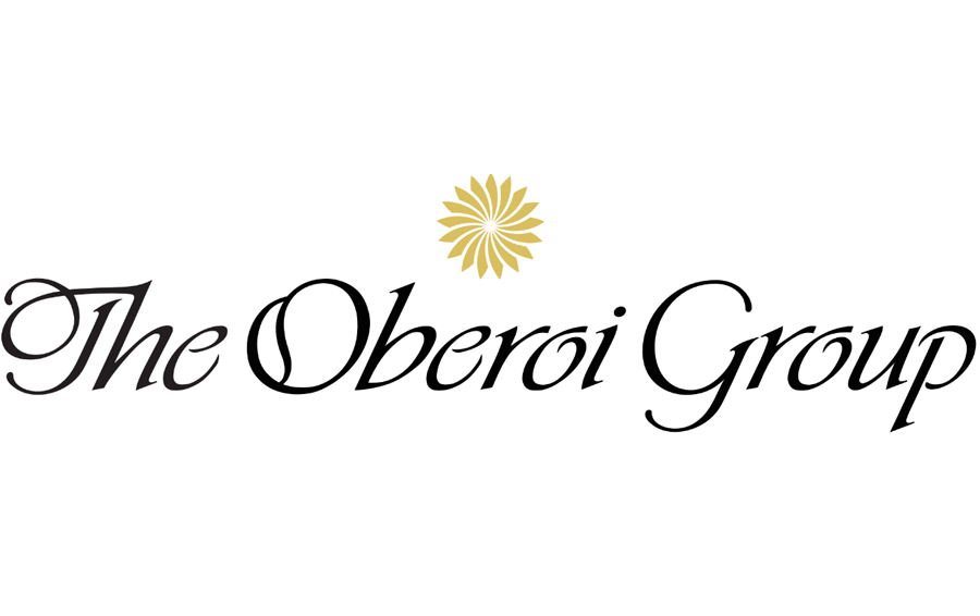 Logo of The Oberoi Group with a sun symbol.