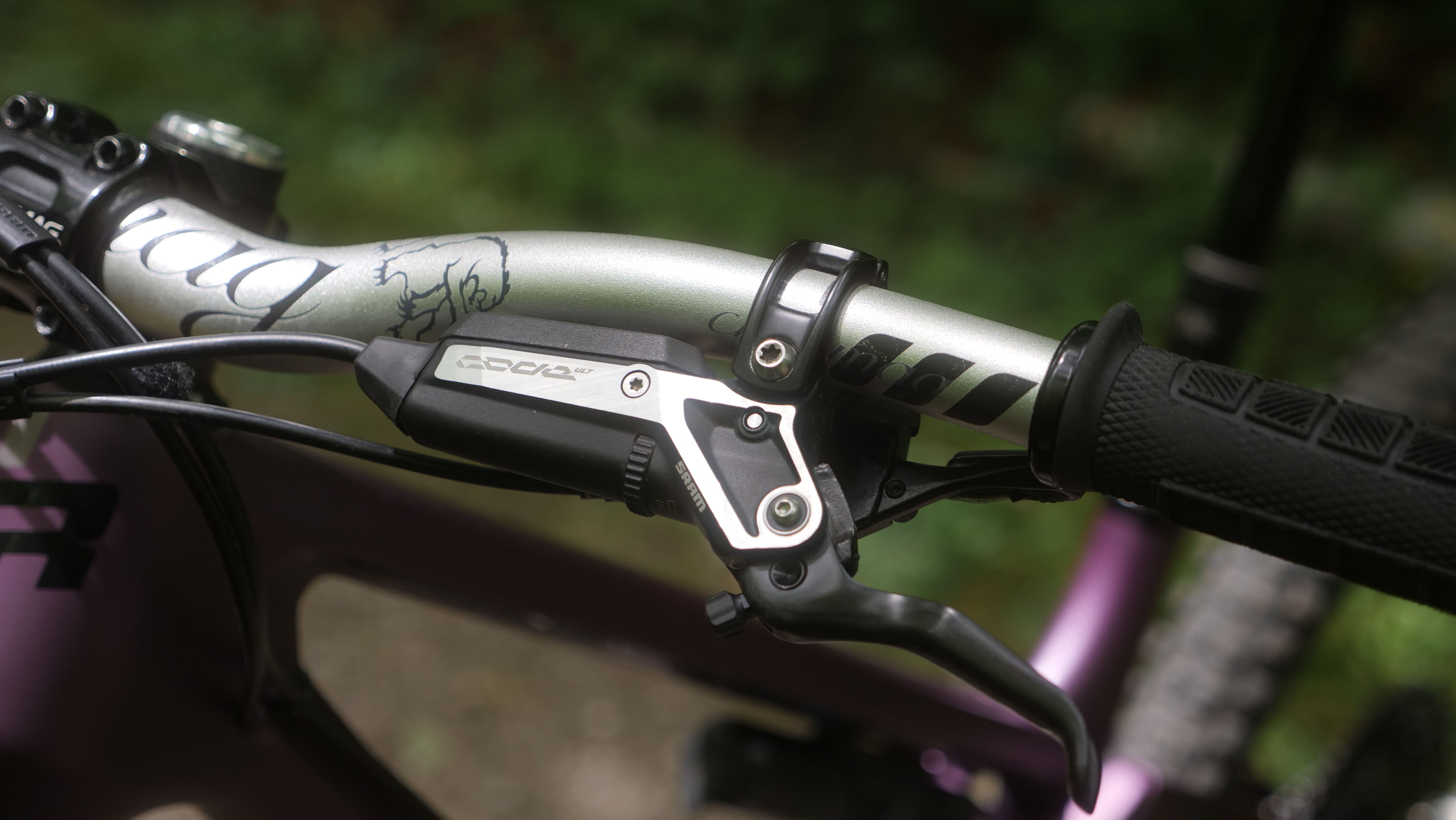 Close-up of a bicycle handlebar with a brake lever and grip.