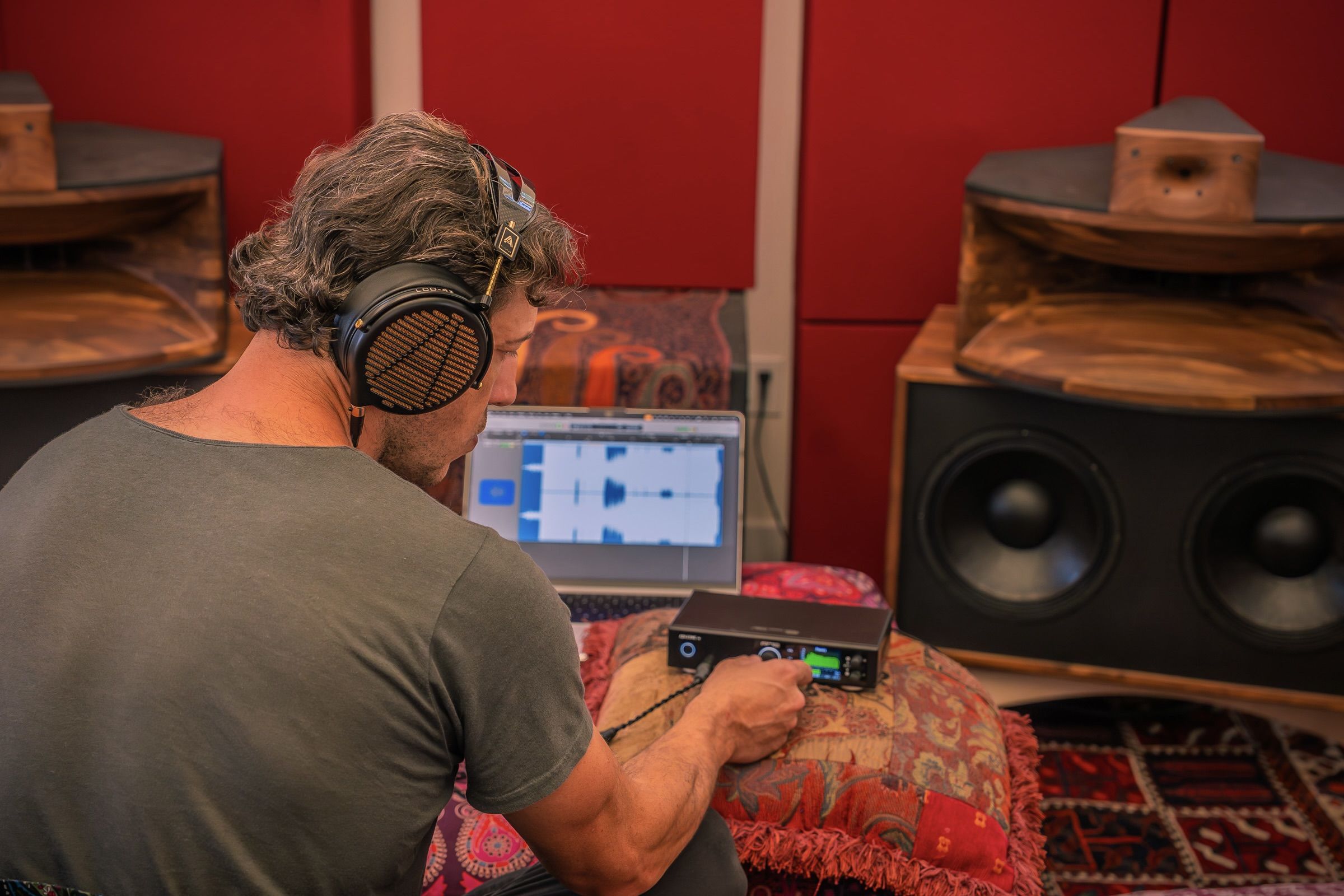 Anton Tumas wearing Audeze LCD-4z headphone mixing on a computer