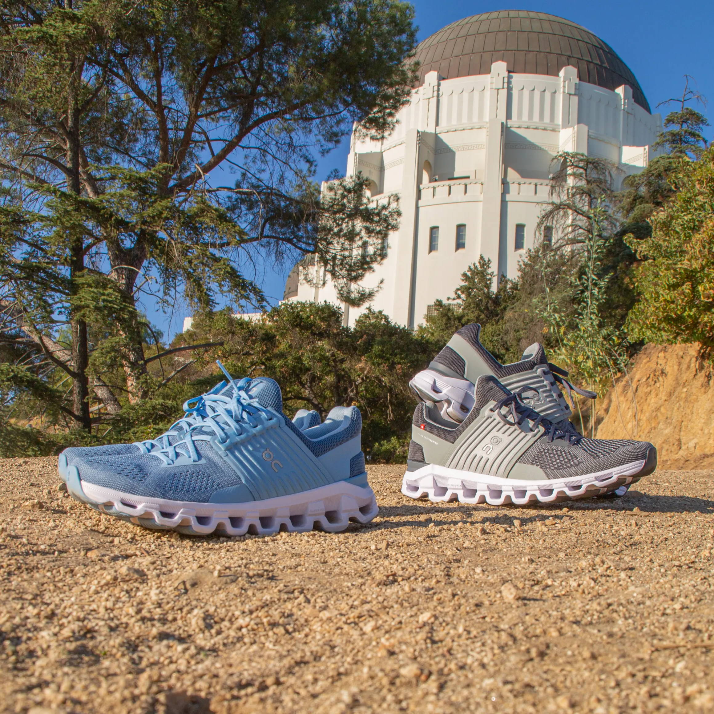 blue and gray on running sneakers in front of griffith observatory
