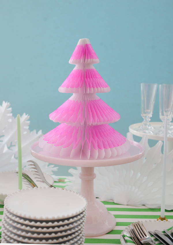 Neon pink honeycomb 3D tree on top of a cake stand.