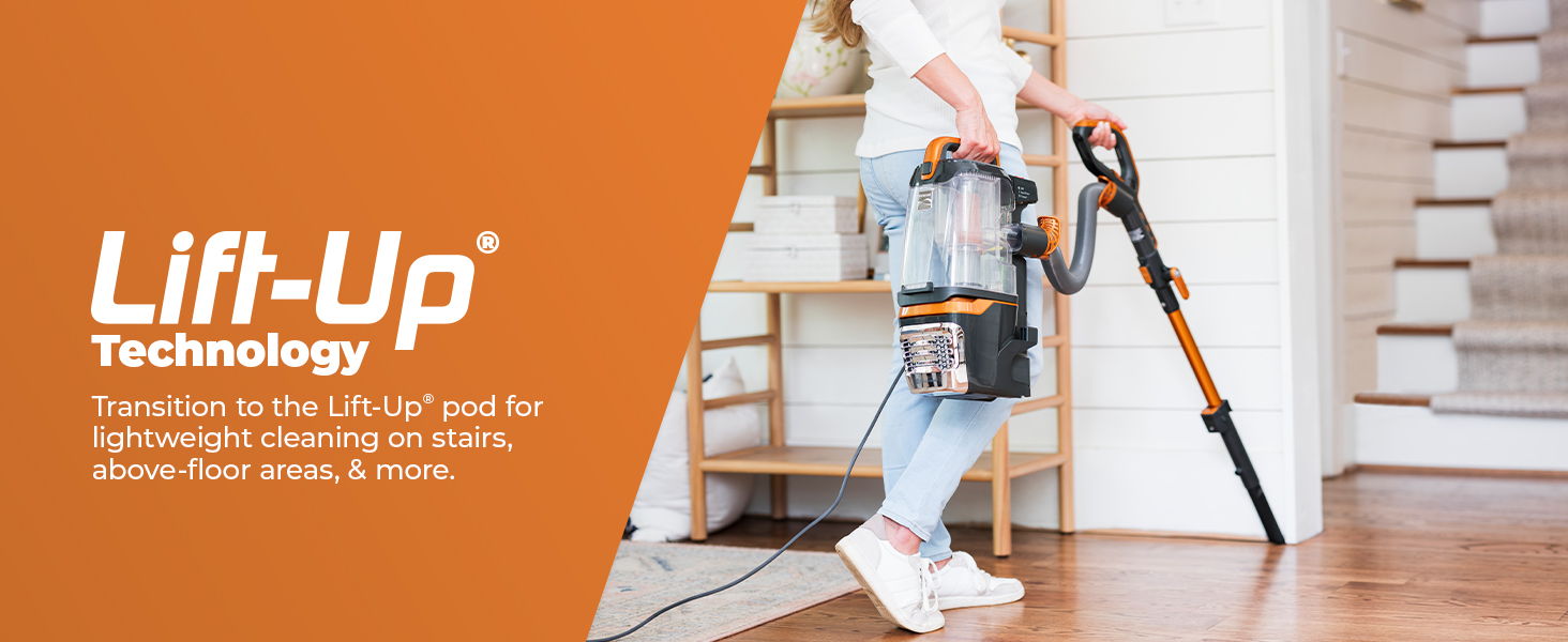 Person using a vacuum cleaner with Lift-Up Technology on wooden floor.