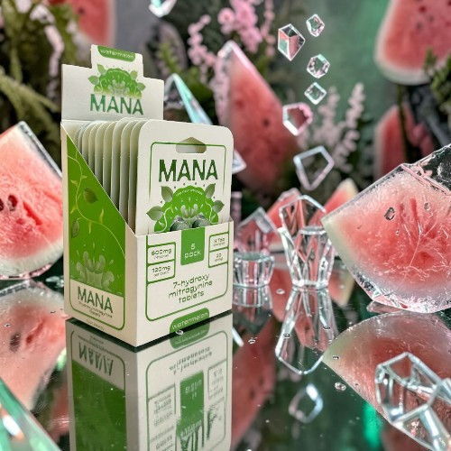 A box of Mana product surrounded by watermelon slices and ice cubes.
