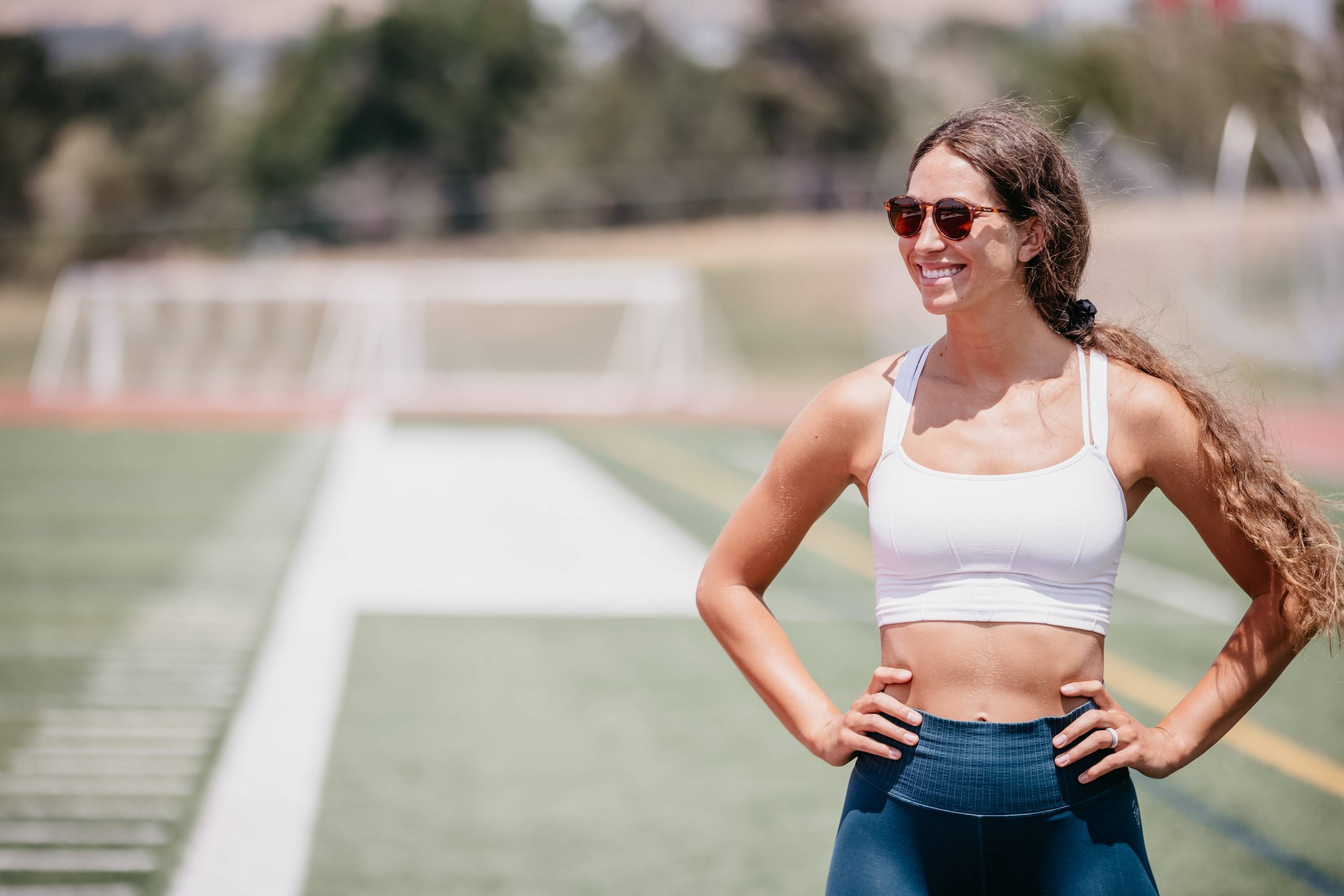 Woman wearing tortoiseshell sunglasses with round lenses