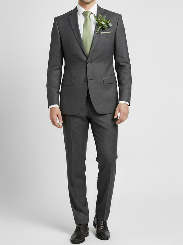 Groomsman wearing a sage tie with a charcoal suit