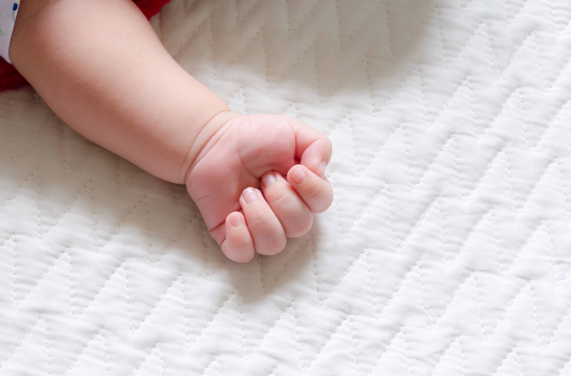 Soft quilted crib mattress cover.