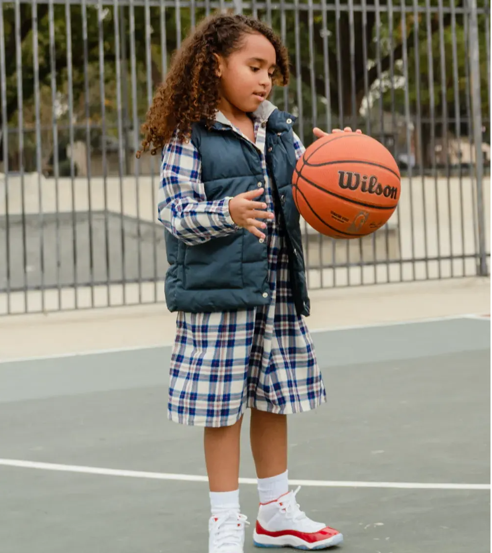 girl playing basketball with aj11 retro cherry 2