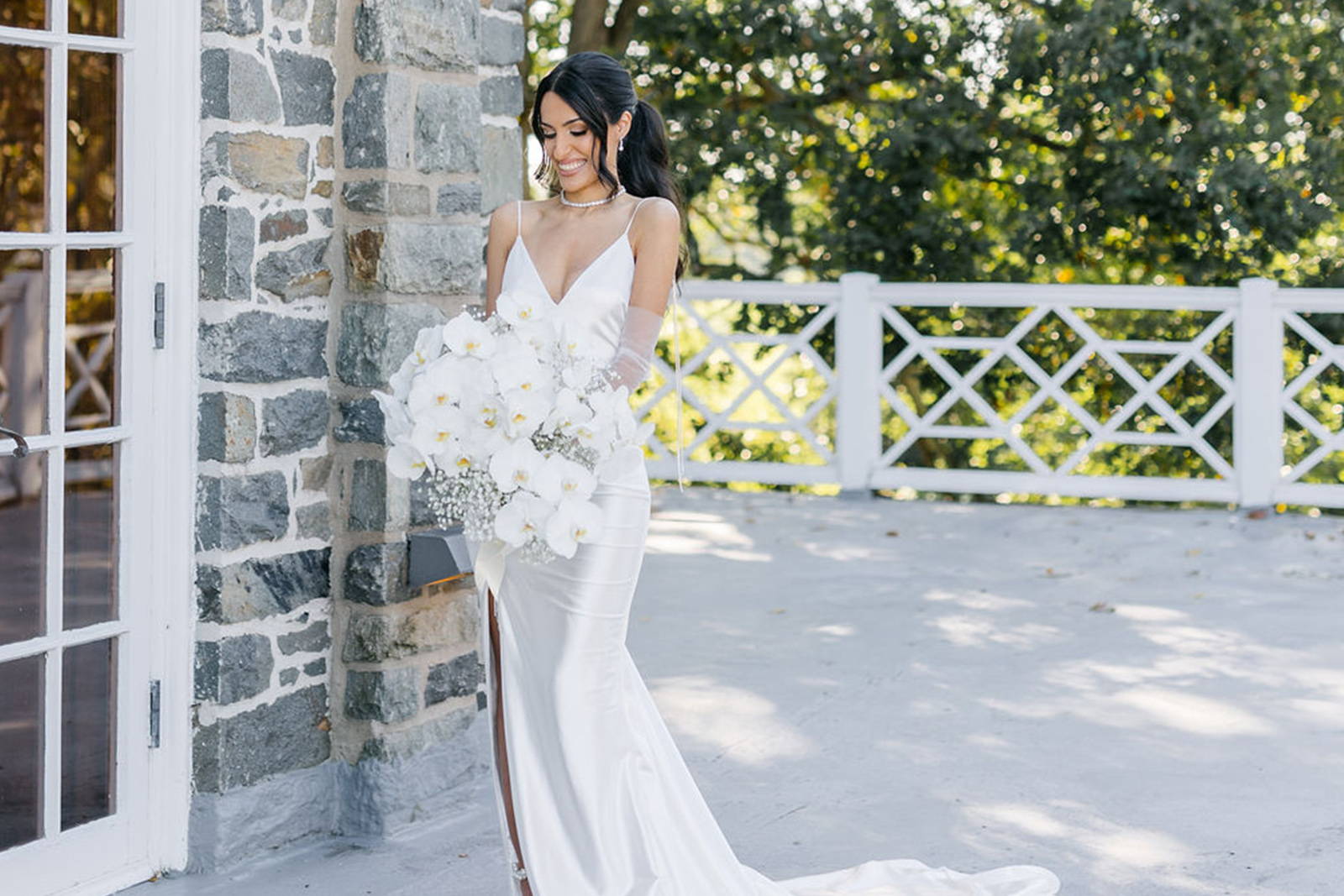 Bride holding her white floral bouquet