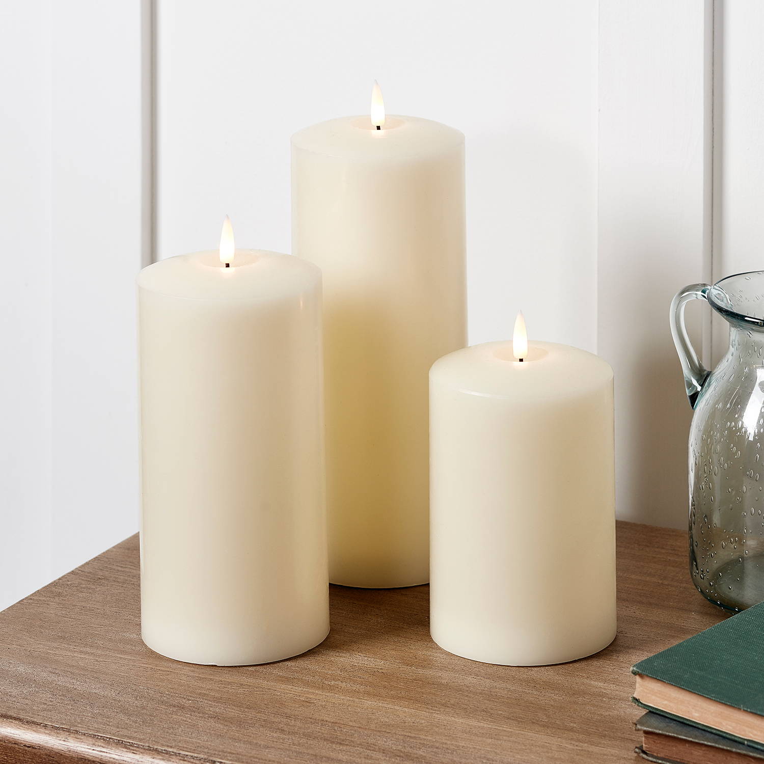 Trio of LED candles on a desk