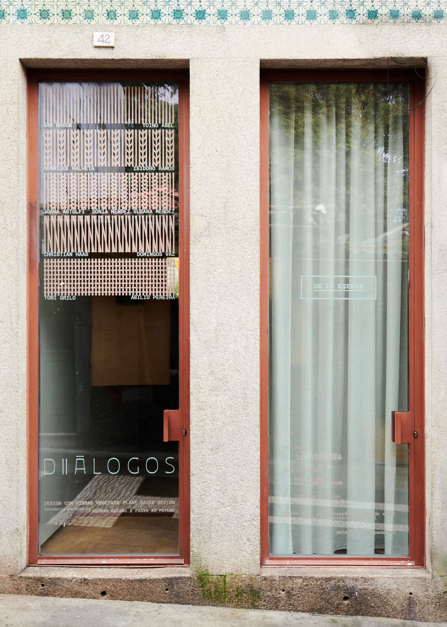 Two glass doors with a sign reading 