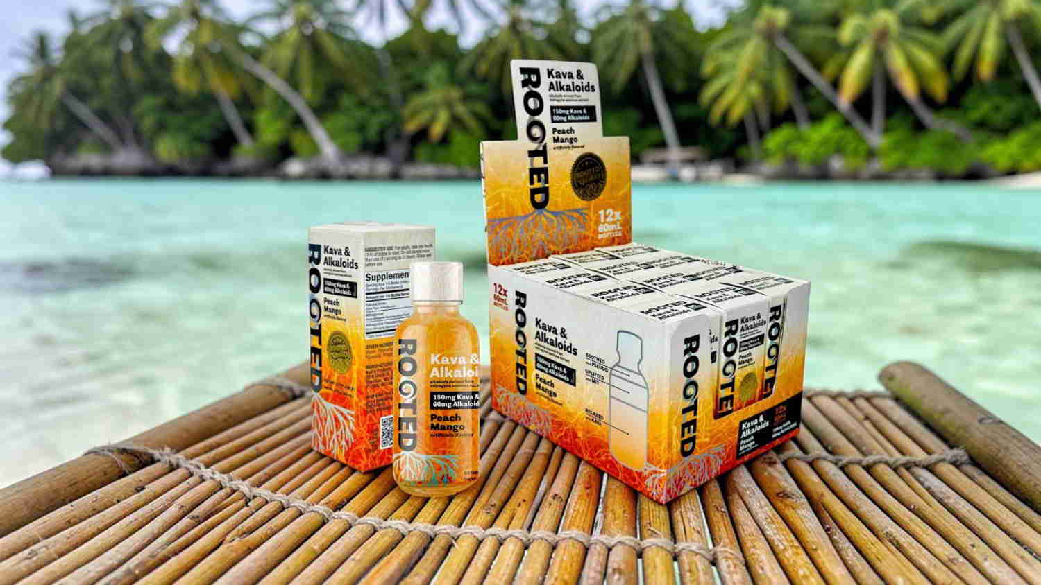 Bottles and boxes of a beverage on a beach with palm trees.