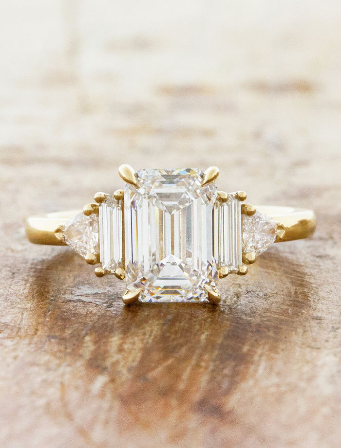 caption:Shown with 2ct emerald cut diamond in 14k yellow gold