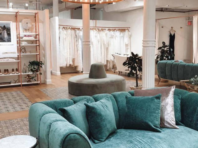 Velvet sage sofas in New York Grace Loves Lace bridal shop
