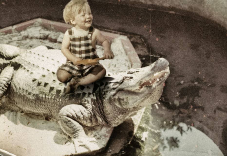 Murph on a gator as a child