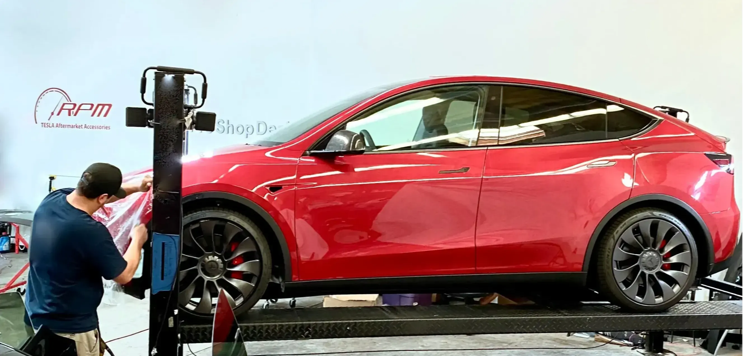 RPM Tesla PPF install — red Tesla Model Y