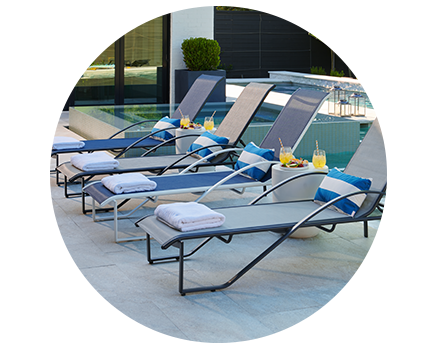 A blue lounge chair with a metal frame.