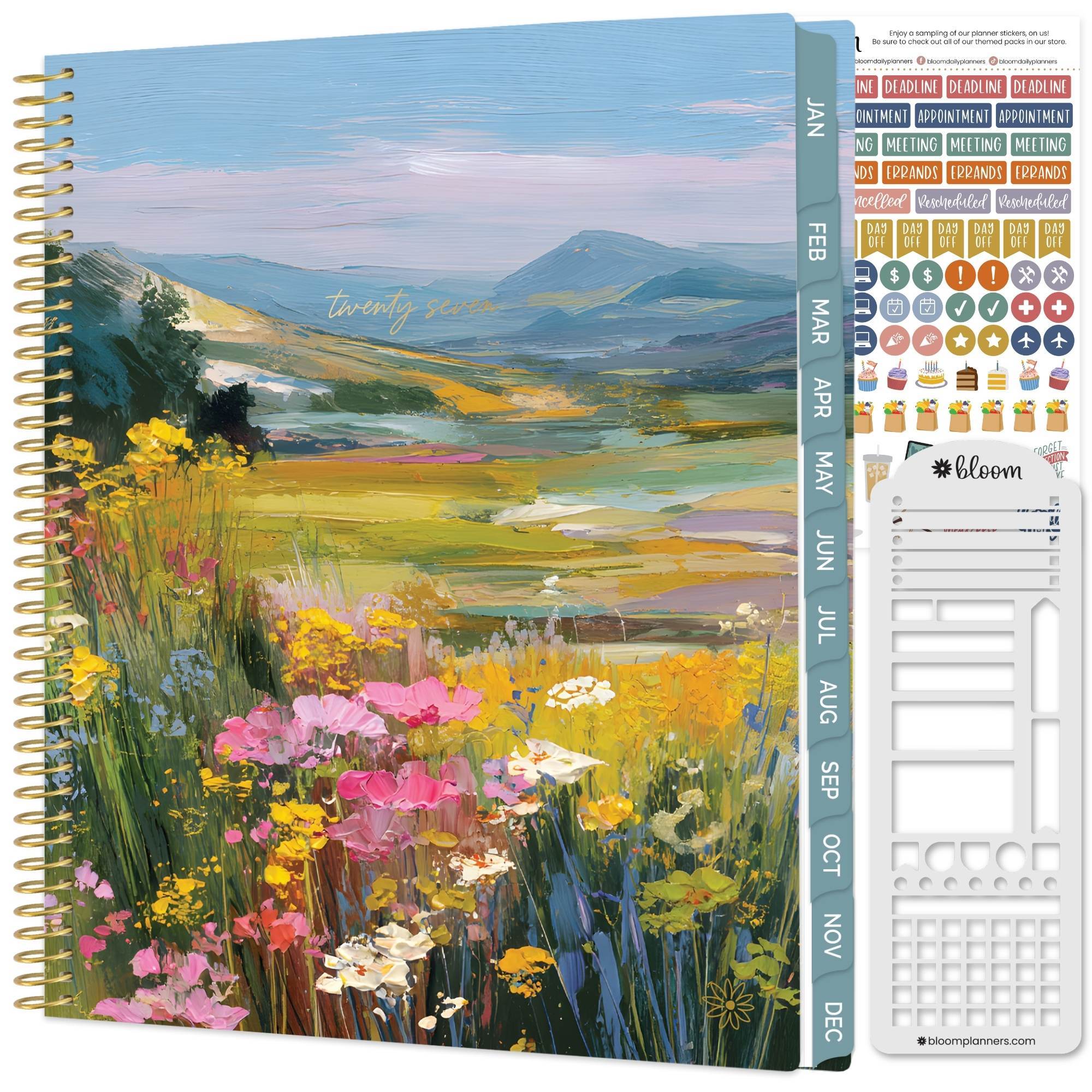 a large soft cover 2027 planner with a mountain landscape and wild flowers on the cover
