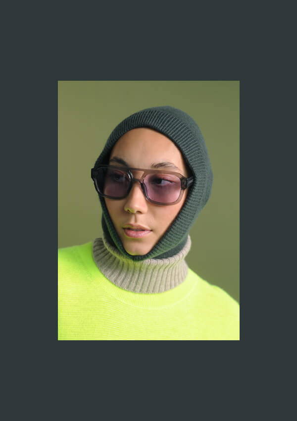 A model wearing the Oversize Roll Collar, Moss Tank and Balaclava styled with the Akjaerbede Kaya sunglasses.