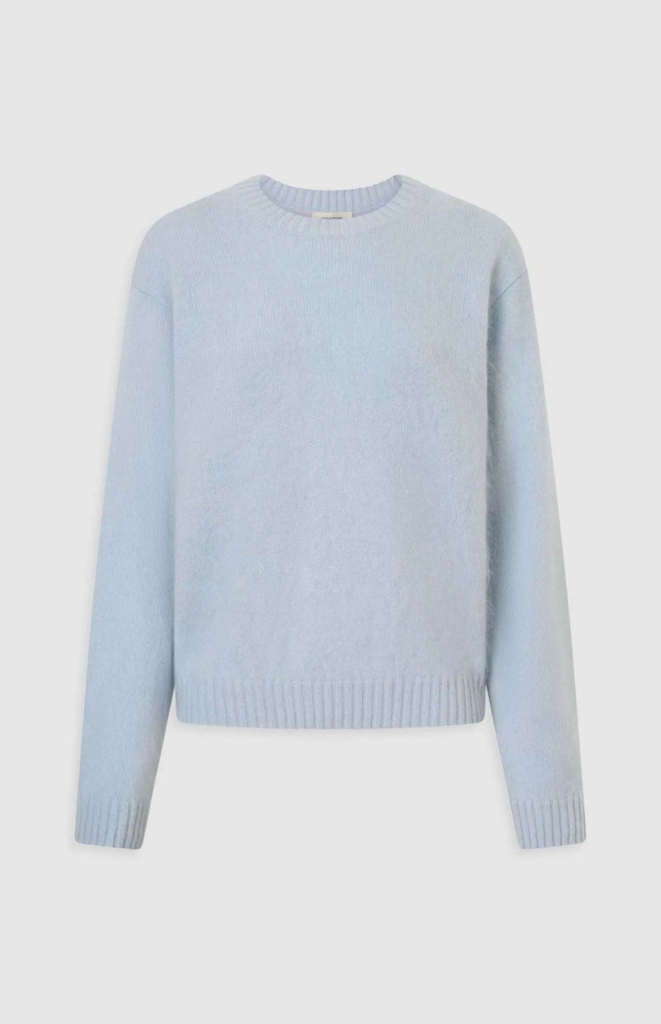 Light blue, long-sleeve sweater with a round neckline.