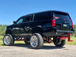 Rear three-quarter lifted Suburban thumbnail