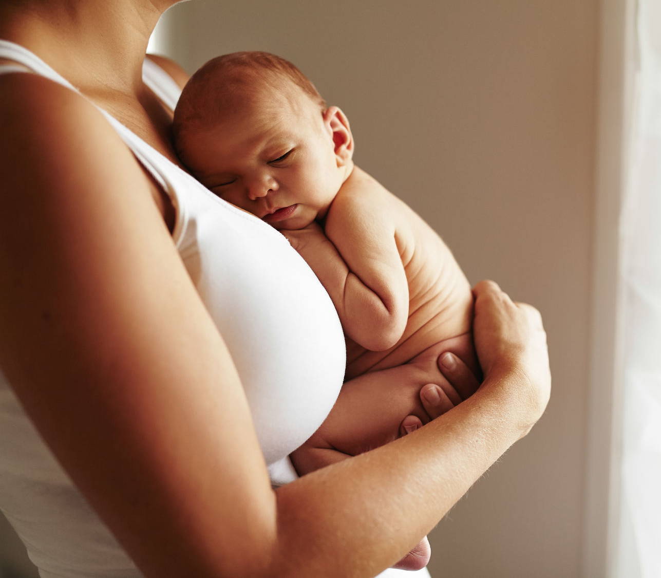 baby sleeps with knees bent