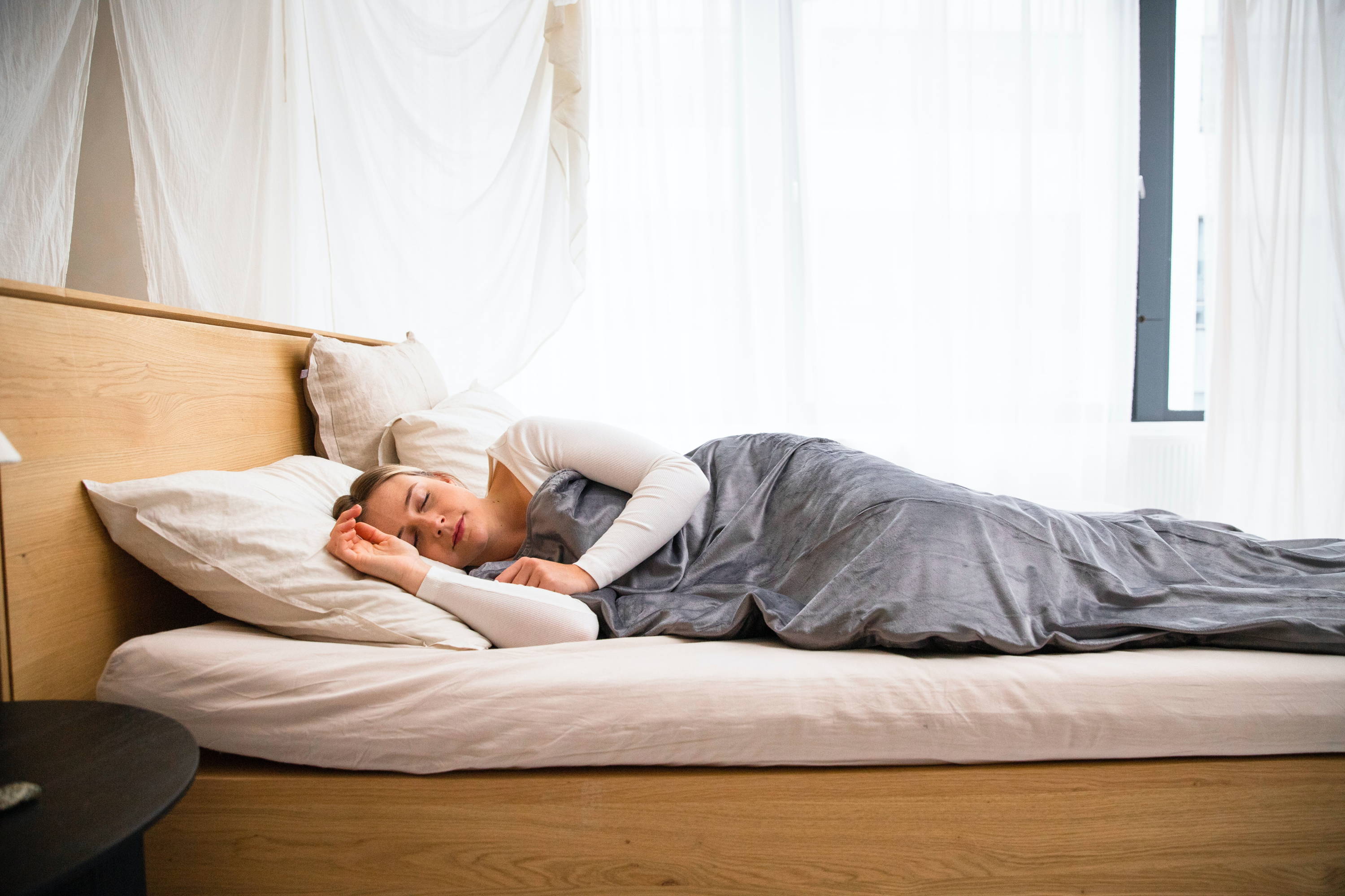 woman sleeping in a heated blanket