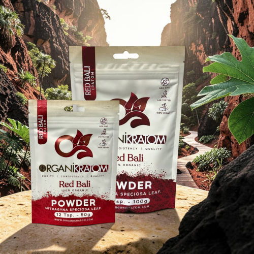 Packages of red powder product in a scenic natural background.