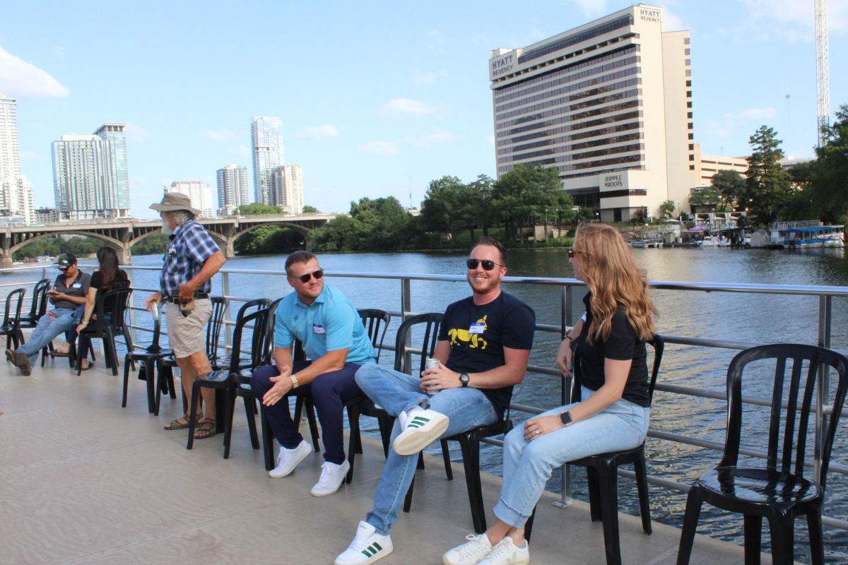 Solar professionals having a conversation on boat on Ladybird Lake