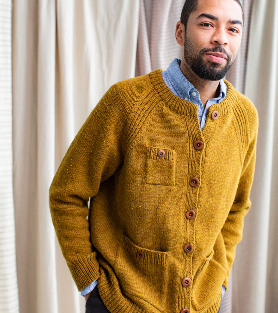 Anthony modeling First Cardigan Sweater sample in Warbler with fold-over neckband