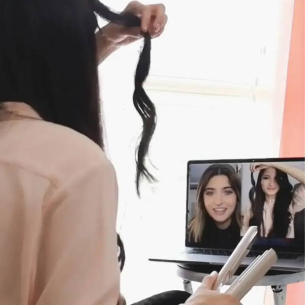 woman taking a styletyme session to learn her styling tool