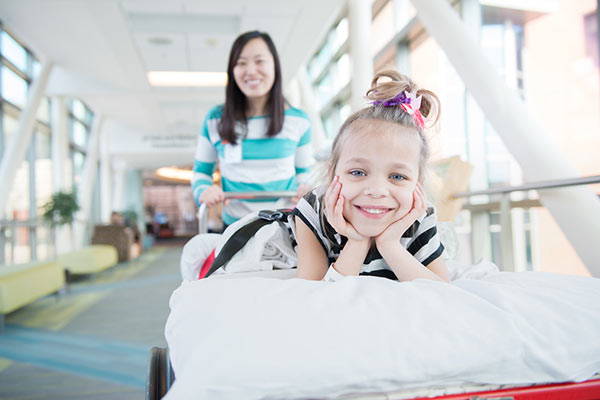 Smiling child on hospital bed