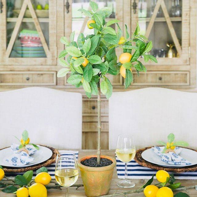 An artificial lemon tree from Nearly Natural decorated on a dinner table