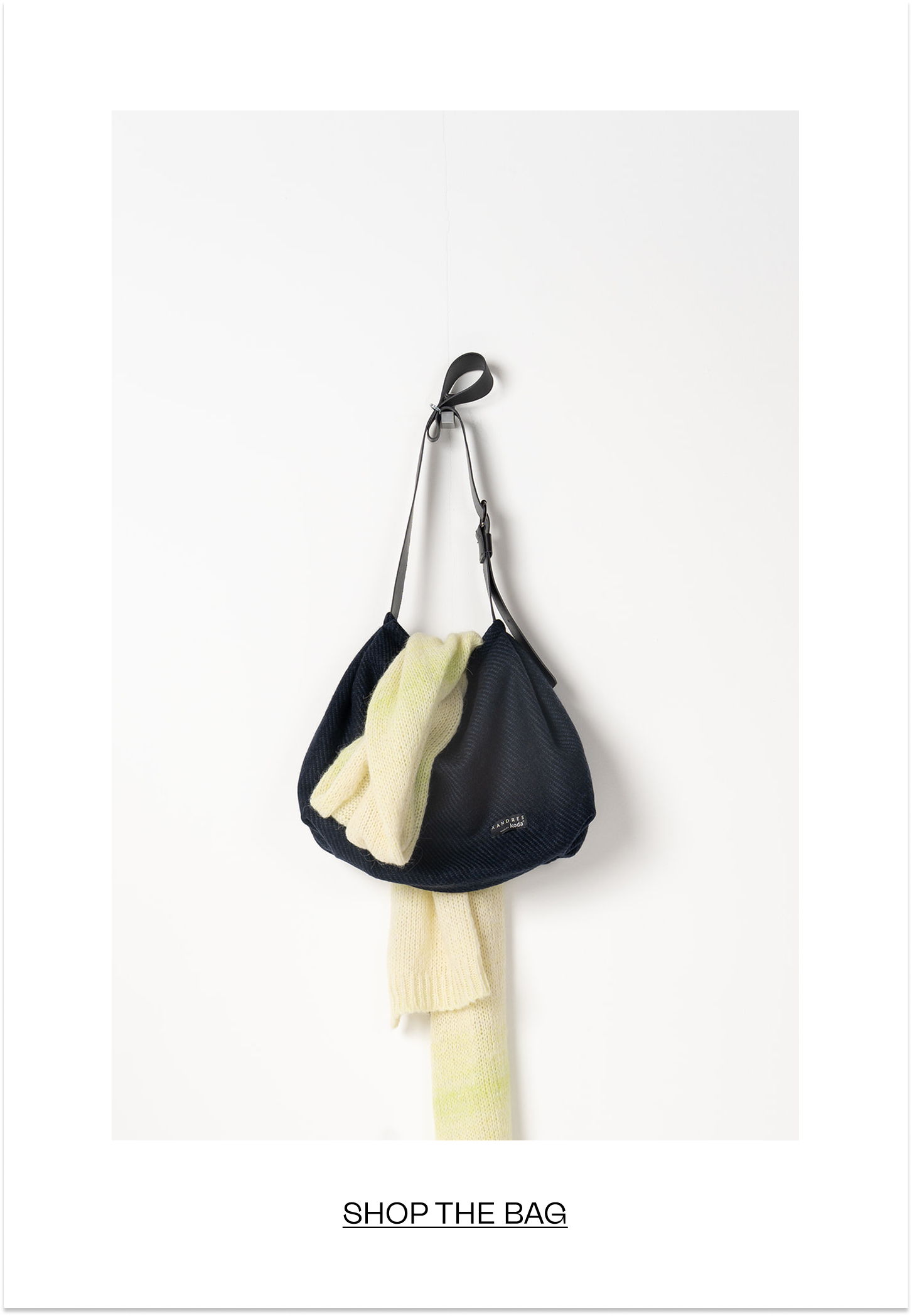 A stylish bag hanging against a white background.
