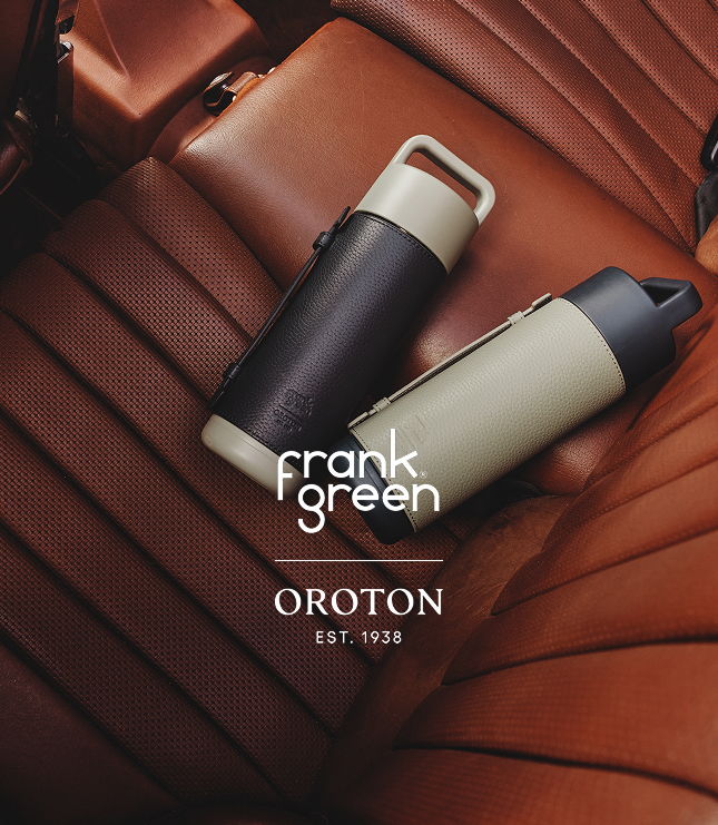 Two stylish drink bottles on a brown leather surface, with brand logos visible.