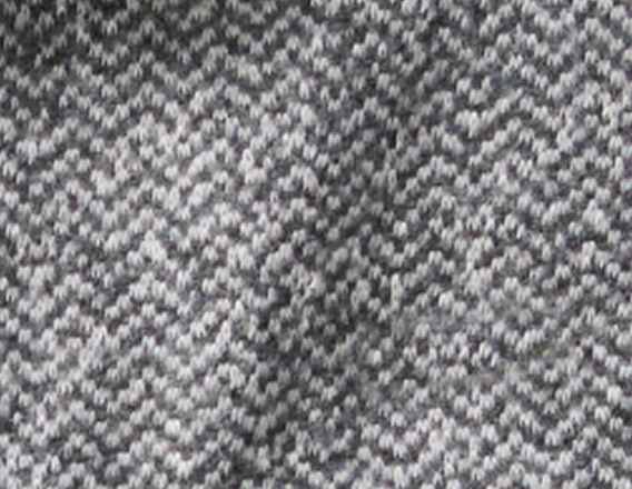 Gray herringbone patterned fabric texture close-up.