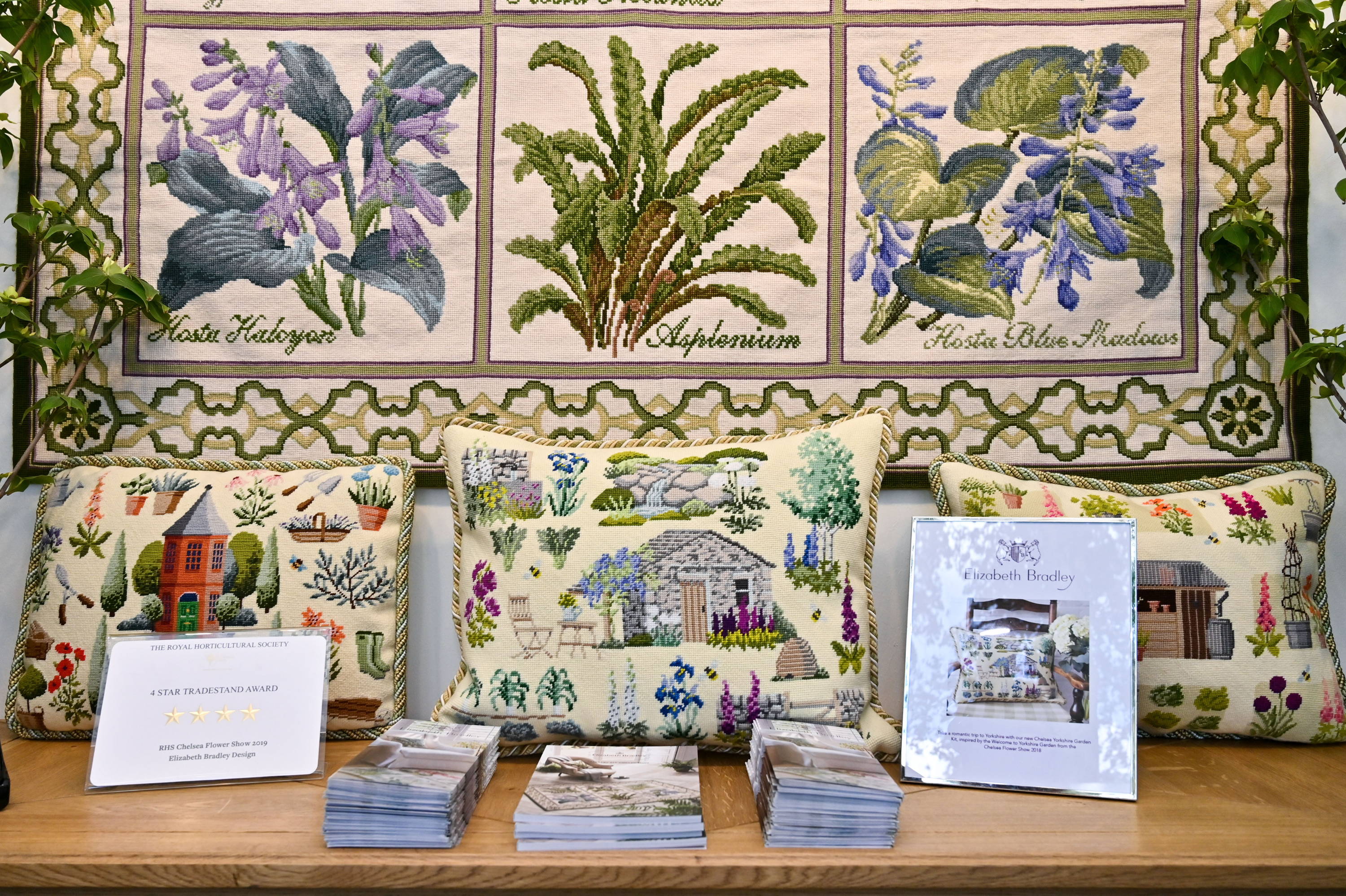Chelsea Gardens finished pillows on table with brochures