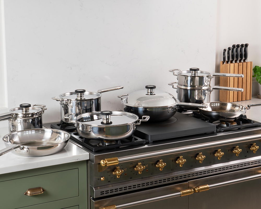 316 Series Cookware on a stove with Professional Knives in the background.