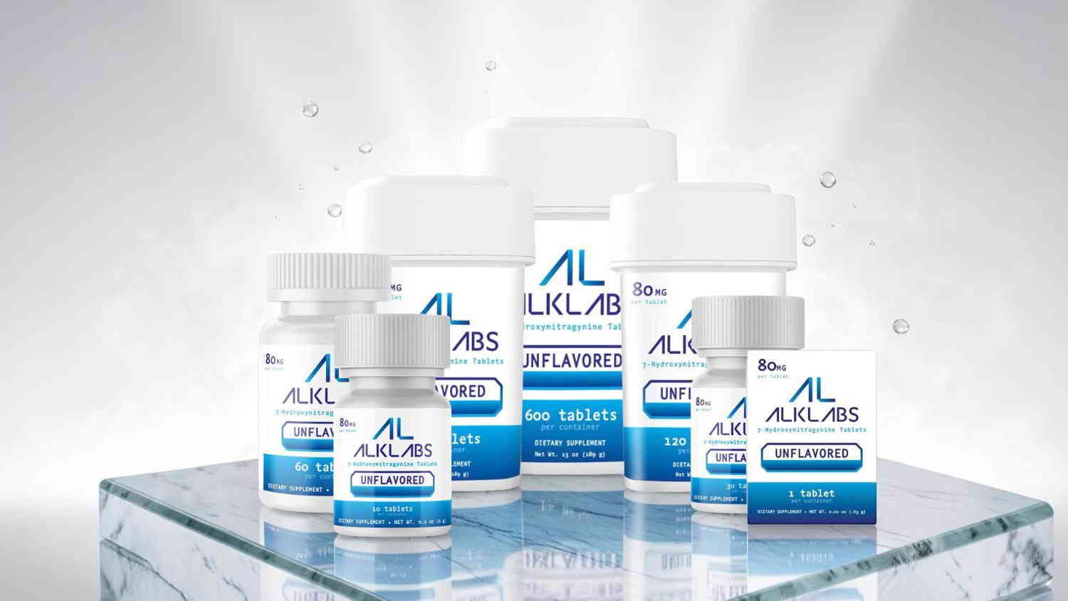 Various health supplement bottles arranged on a glass surface with bright background.