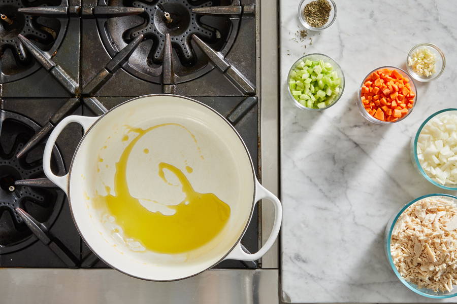 New pot on stove with olive oil inside