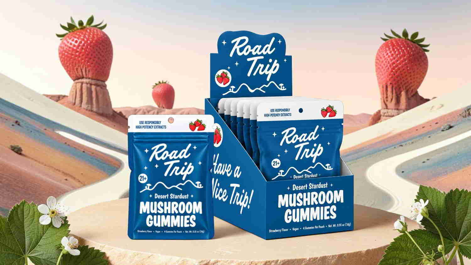 Blue packaging of mushroom gummies with strawberries in the background.