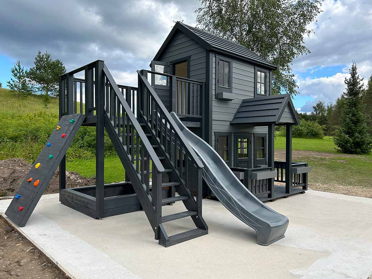 Custom_2-Storey_Kids_Playhouse with gray slide, a climbing wall and sandbox by WholeWoodPlayhouses