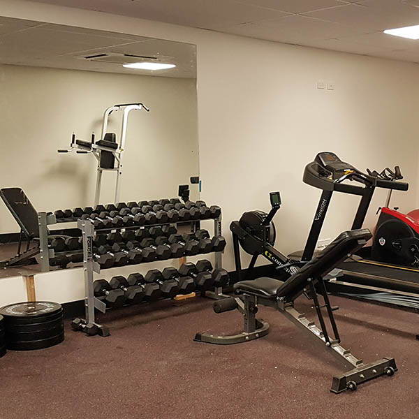 Fire Station Gym Fit Out including a hex dumbbells rack and bench for a comprehensive free weight training experience