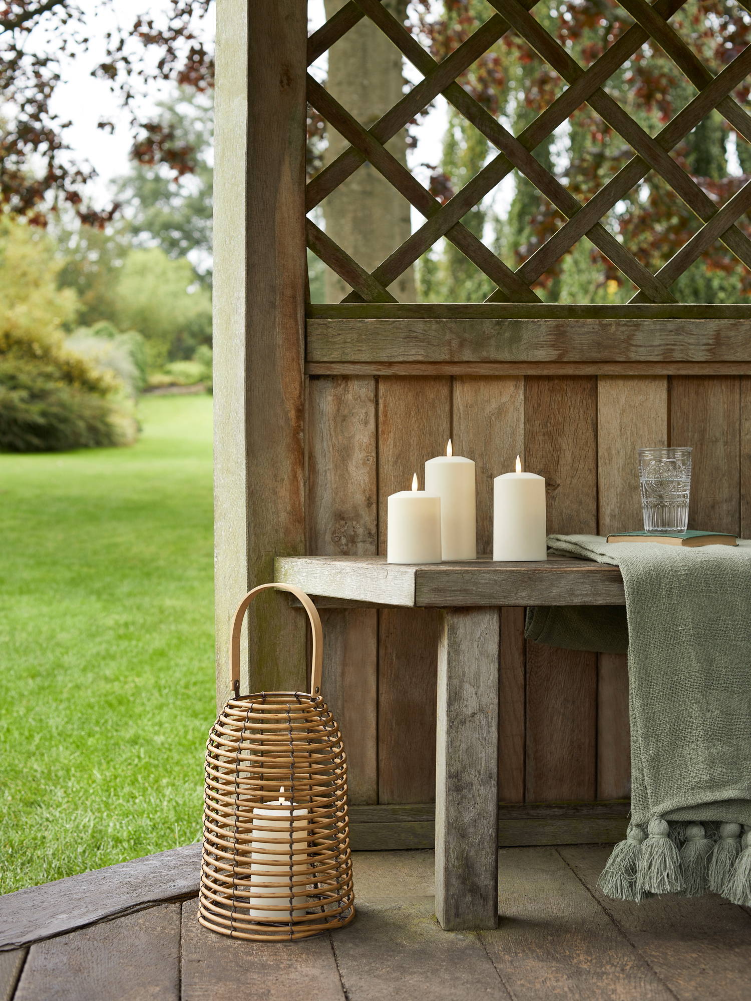 Garden shelter featuring outdoor lanterns and LED candles
