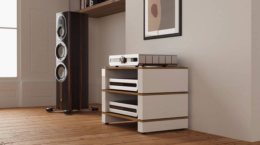 Modern audio equipment setup in a stylish room with wooden flooring.