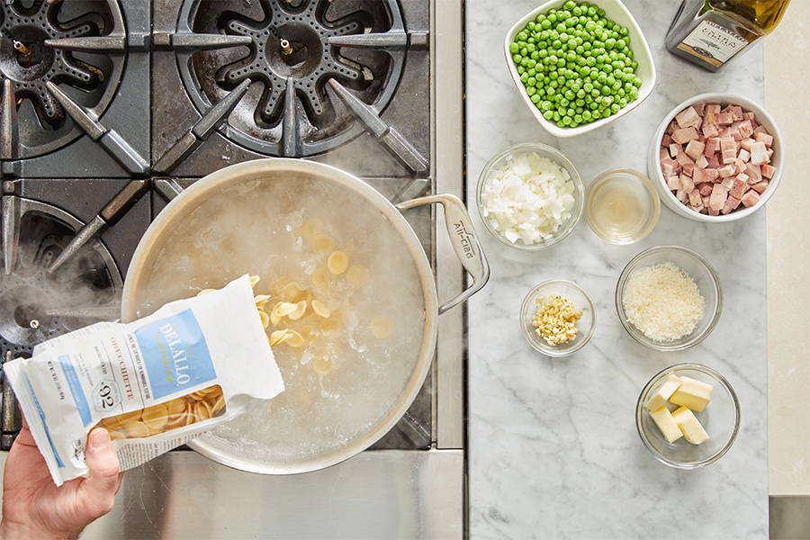 Orecchiette pasta added to boiling water