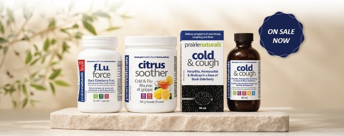 Four health supplement containers on a stone surface, with a sale sign.